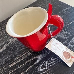Heart shaped “Cup of Love” mug by Hallmark. Makes heart shape when filled.